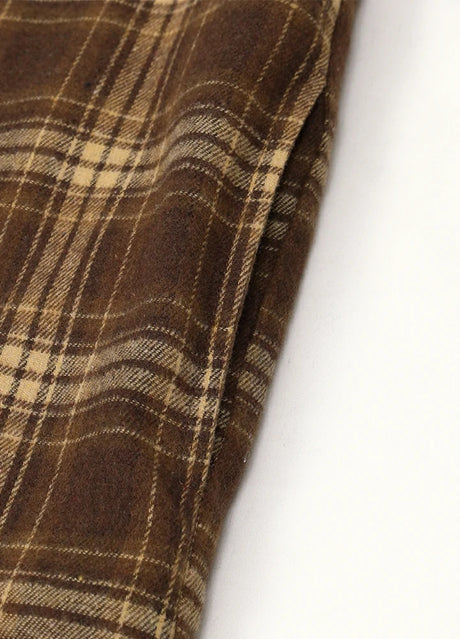 Close-up of the seam pocket of chocolate men's workwear flannel shacket with hood 