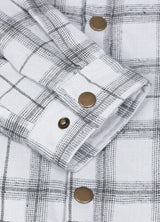 Close-up of the cuff of silver scape men's snap button flannel plaid jacket