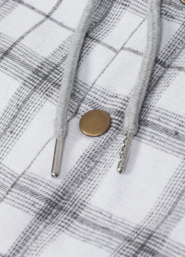 Close-up of the snap button of silver scape snap button flannel plaid hoodie for men