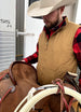 A cowboy in a dark coffee men's reversible vest