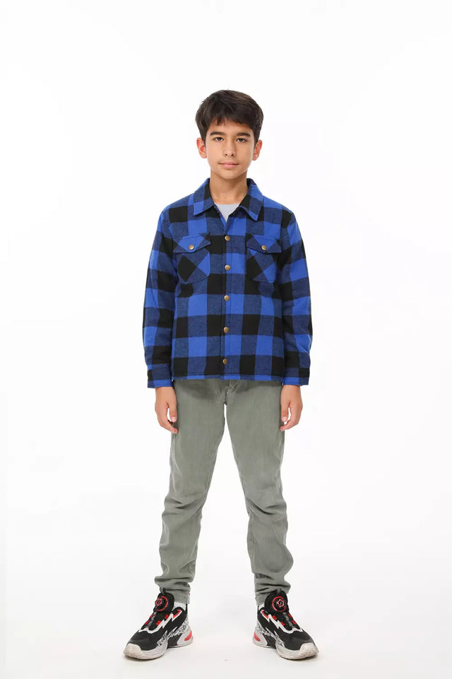 A boy in checkered blue cotton flannel shacket