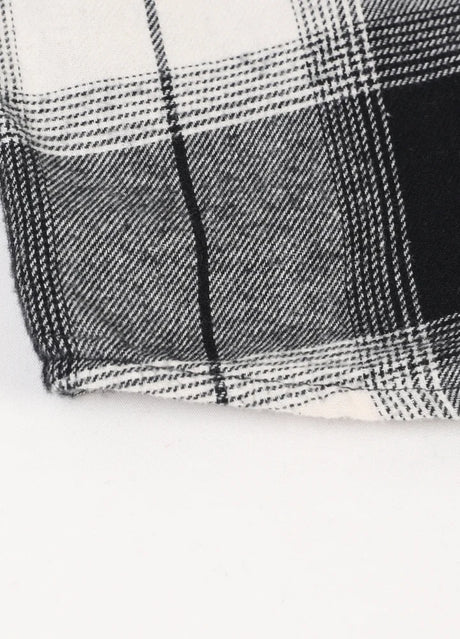 Close-up of kid's soft flannel shirt with cozy fabric and visible stitching