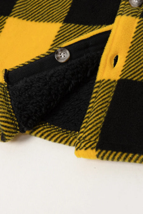 Detail of girls yellow black fleece flannel shirt jacket fabric