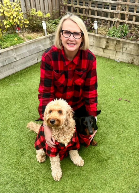 Beautiful woman and her adorable dogs in flannel