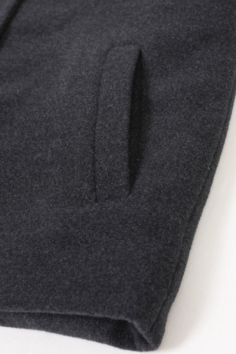 Detailed view of grey boy's wool peacoat with hand pocket