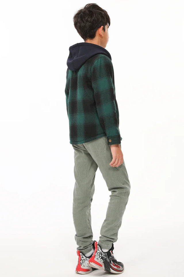 A boy with his back to the camera wearing a green toddler full-zip plaid flannel hood