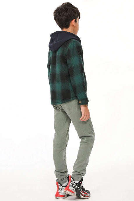 Back view of boy in green hooded flannel jacket