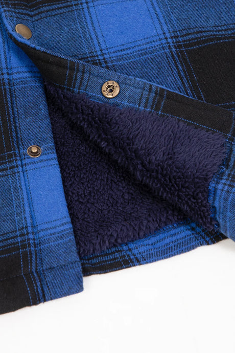 Close-up of the snap button of midnight blue hooded plaid flannel shirt jacket