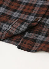 Detailed view of kids flannel plaid shirt with shirttail hemline