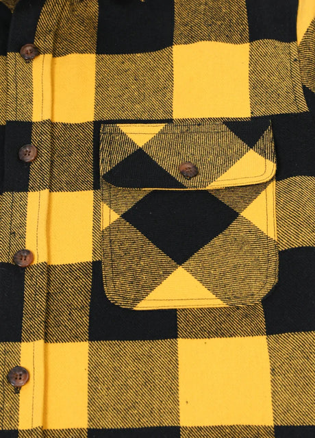 Close-up of the pocket of yellow black men's heavyweight flannel plaid shirt