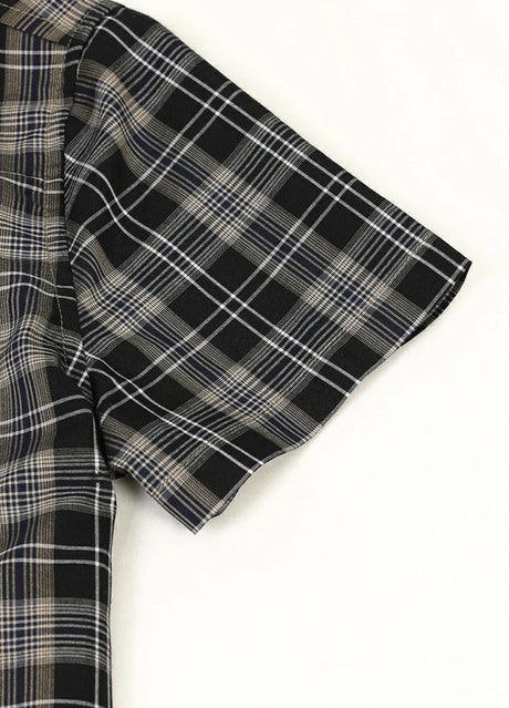 Detail of kids plaid short sleeve shirt with neatly hemmed cuff