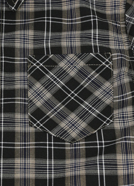 Detailed close-up of single chest pocket on kids plaid short sleeve shirt