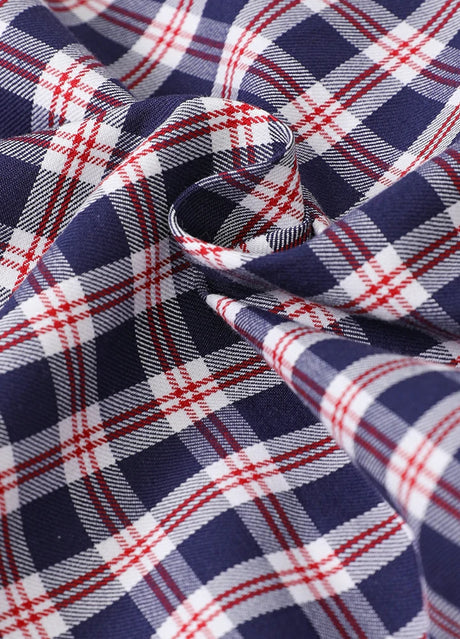 Detailed view of plaid pattern on kids navyberryshort-sleeve shirt fabric