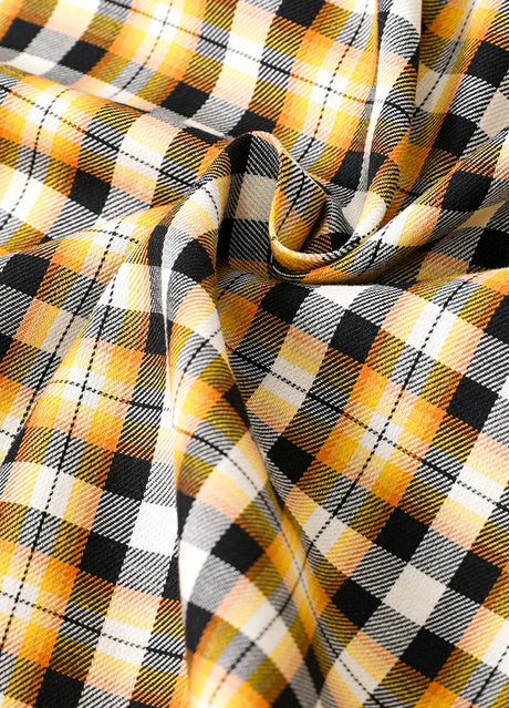 Detailed close-up of plaid pattern on kids bumblebee short-sleeve shirt fabric