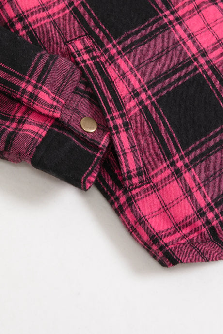 Detail view of the side pocket of pink toddler full zip flannel plaid hoodie