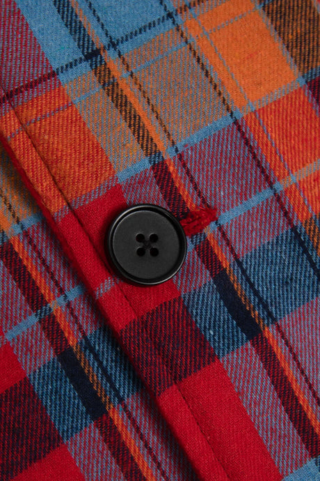 Detail of flannel plaid pattern lining on kids hooded button-up cape