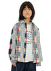 Boy who wears a long sleeve pathwork flannel shirt