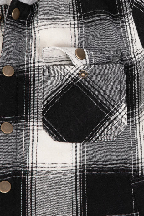 Detail of boys and girls midnight black flannel jacket pocket with foldover flap