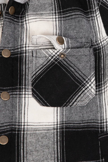 Detail of boys and girls midnight black flannel jacket pocket with foldover flap