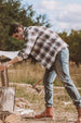 A man chopping wood in a coffee white men's stalwart heavyweight cotton plaid shirt