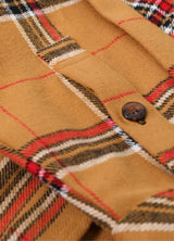 Close-up of the button of sunset plaid men's heavyweight flannel shirt