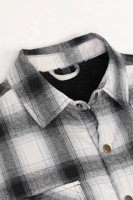 Close up of the lapel of midnight snowfall men's sherpa lined flannel plaid jacket