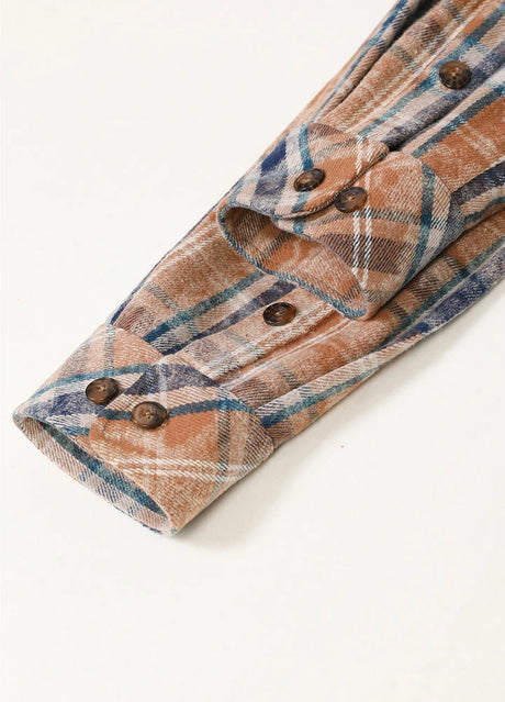 Detail of adjustable cuffs with multiple buttons on men's acid plaid flannel shirt