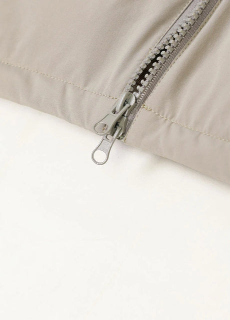 Close-up of the zipper of light gray heavyweight flannel lined puffer vest for men