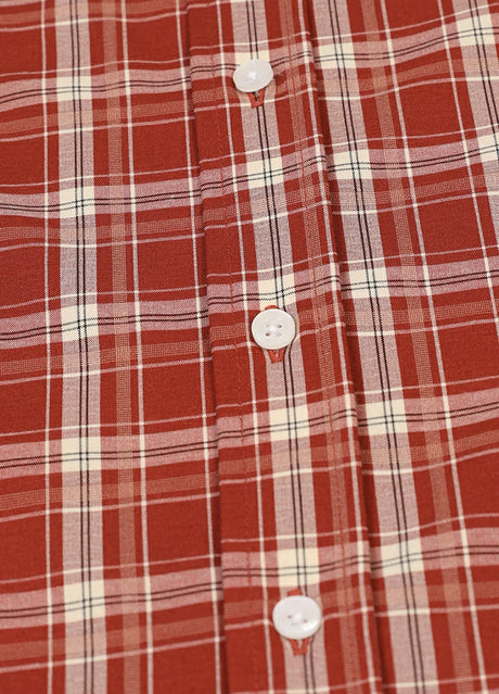 Close-up of the button of rust red lightweight plaid short sleeve shirt for men