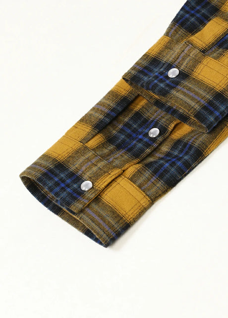 Close-up of the cuff of yellow blue men's plaid outdoor long sleeve western shirt