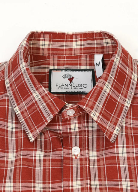 Close-up of the lapel of rust red men's checked short sleeve shirt