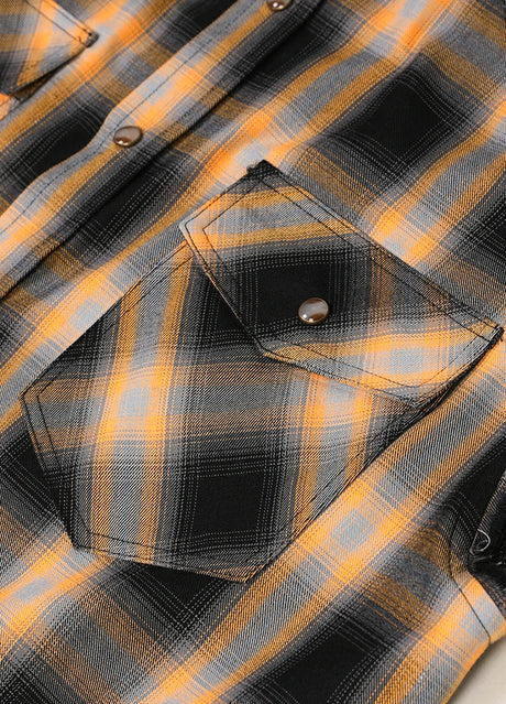 Close-up of the pocket of orange men's durable western outdoor plaid vest