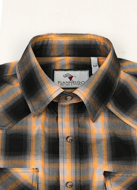 Close-up of the lapel of orange men's durable western snap pearl plaid vest