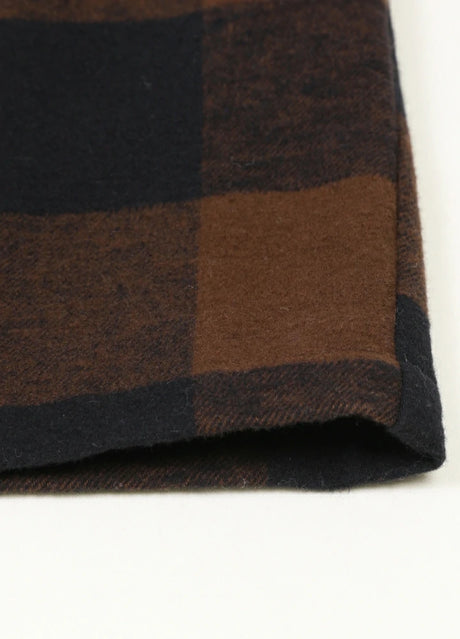 Close-up of the hem of the mocha zip up plaid jacket for men