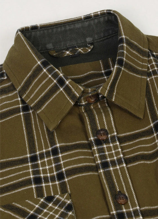 Close-up of the lapel of hunter green men's rugged ridge suede flannel shirt 