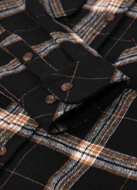 Close-up of the cuff of dark chocolate men's stalwart cotton flannel plaid shirt