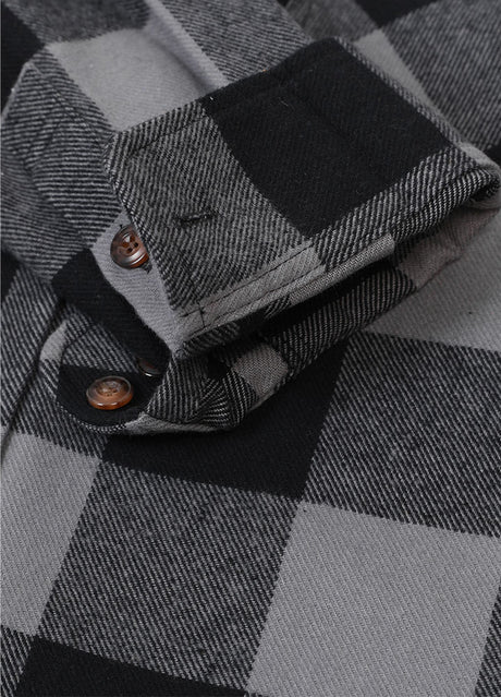 Detailed view of the cuff of gray men's rugged stiff outdoor flannel plaid shirt