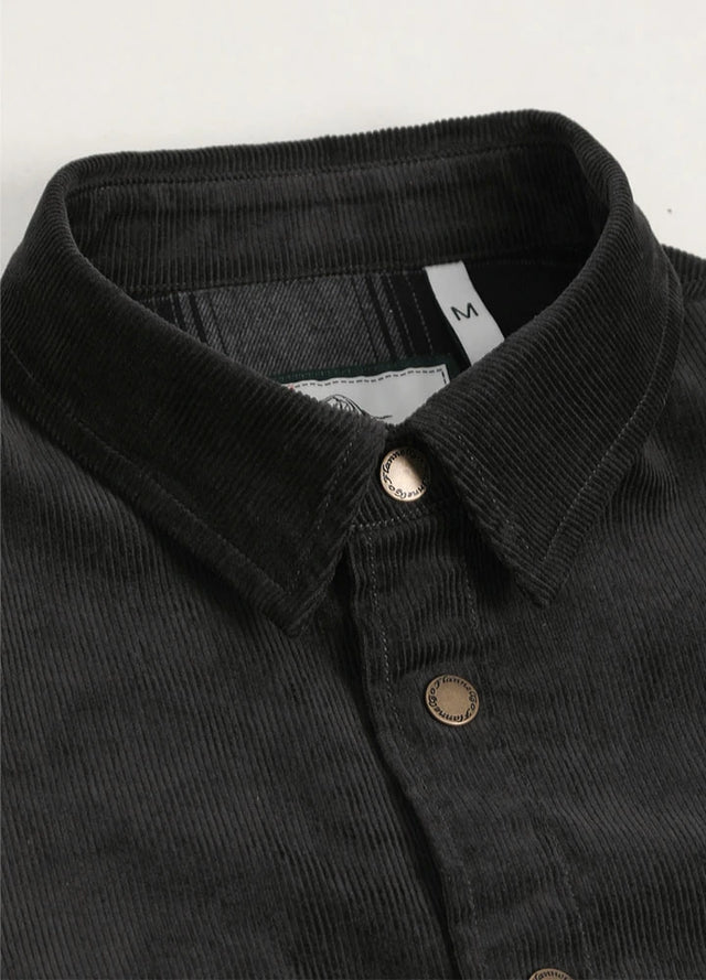 Close-up of men's charcoal shirt jacket with corduroy collar