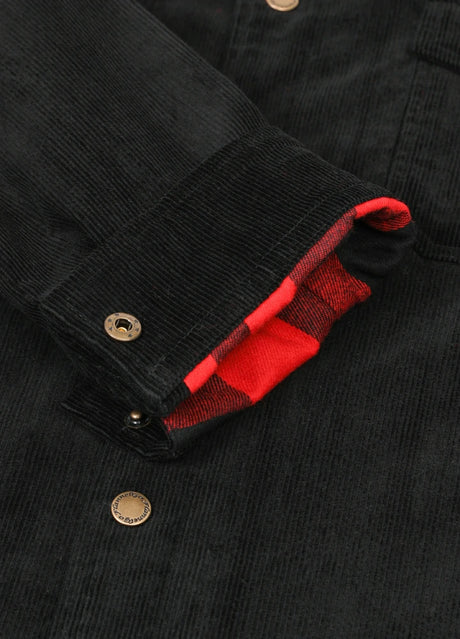 Detail of black men's corduroy shirt jacket with adjustable cuffs with snap button