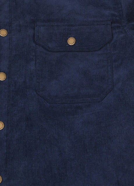 Detail of men's navy corduroy shirt jacket pocket with button