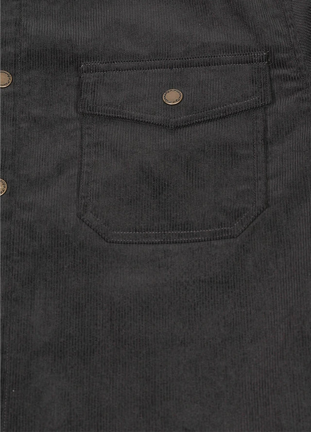 Close-up of men's charcoa corduroy shirt jacket with snap-stud chest pockets