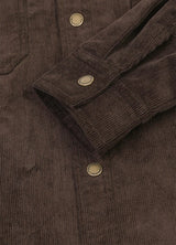 Detail of adjustable cuffs with snap button on men's corduroy shirt jacket