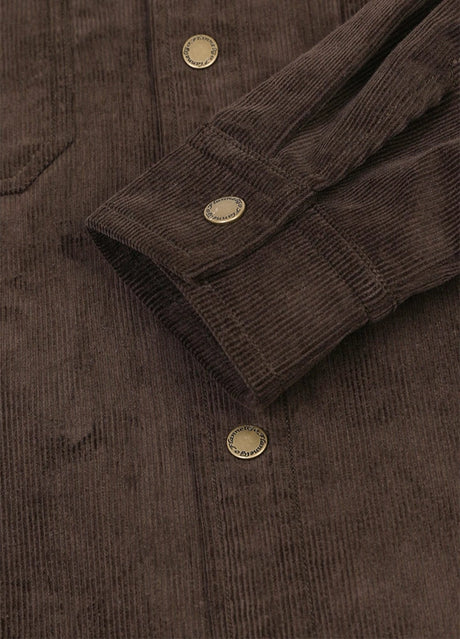 Detail of adjustable cuffs with snap button on men's corduroy shirt jacket