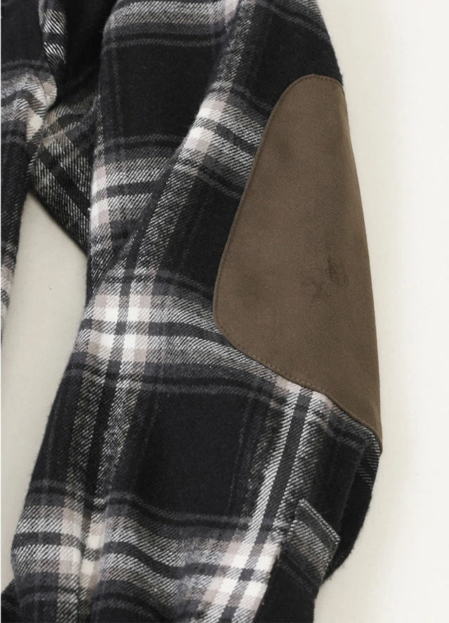 Detailed view of the elbows of classic noir men's rugged ridge warm flannel shirt