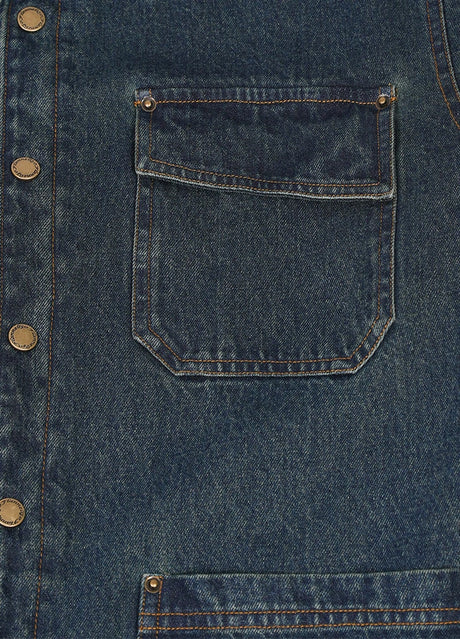 Close-up of the pocket of indigo men's classic denim flannel lined shirt jacket 