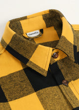 Close-up of a lapel of yellow black men's stalwart cotton plaid shirt 