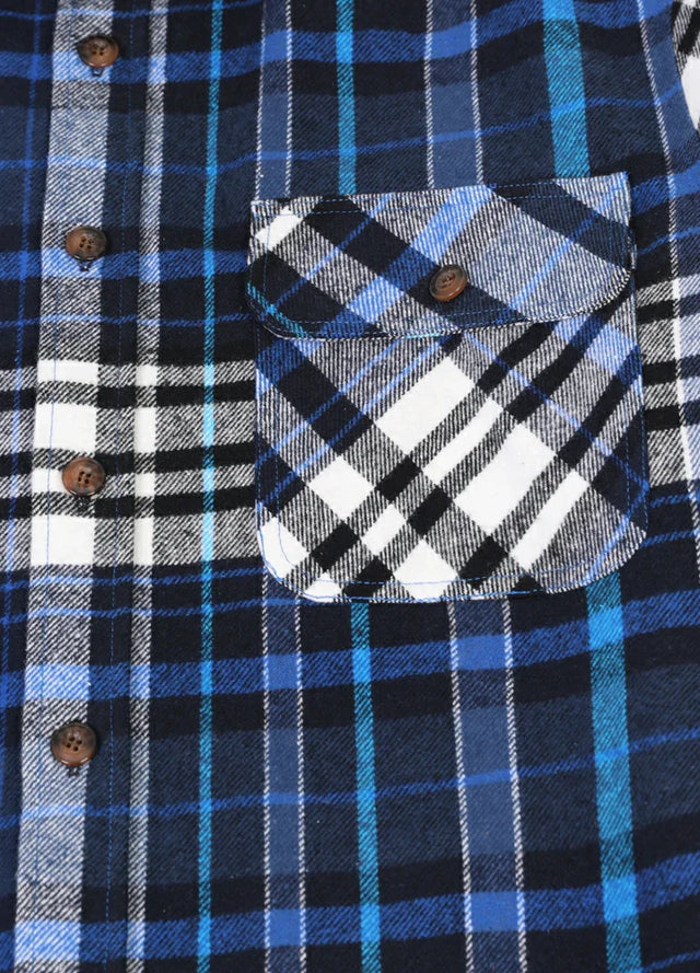 Close-up of the pocket of royal blue men's heavyweight flannel plaid shirt