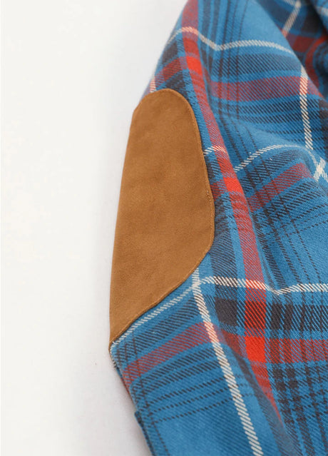 Close-up of the elbows of peacock blue men's rugged ridge warm flannel shirt