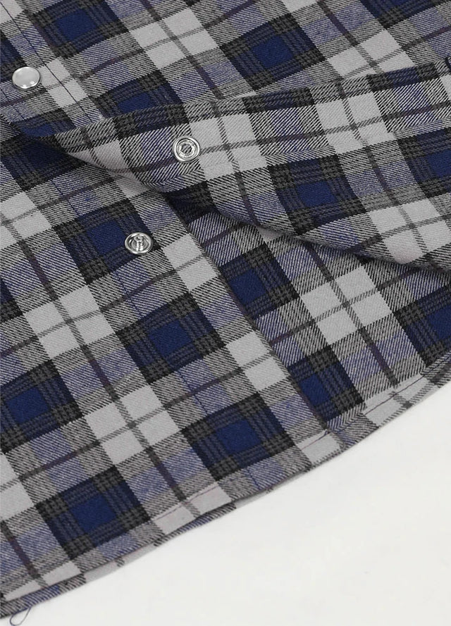 Close-up of the snap button of stormy indigo men's western short sleeve plaid shirt 