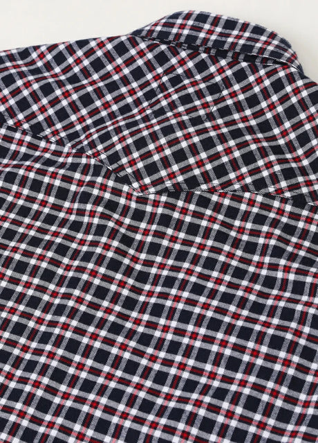 Detail of high-density stitching on men's flannel cotton plaid vest